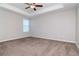 Spacious bedroom with carpeted floor and window at 13419 Lake Monroe Pl, Riverview, FL 33579