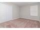 Bedroom with double door closet and window at 13419 Lake Monroe Pl, Riverview, FL 33579