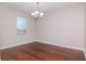 Dining room with hardwood floors and chandelier at 13419 Lake Monroe Pl, Riverview, FL 33579