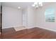 Dining room with hardwood floors and chandelier at 13419 Lake Monroe Pl, Riverview, FL 33579