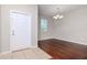 Dining room with hardwood floors and chandelier at 13419 Lake Monroe Pl, Riverview, FL 33579