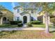 Two-story house with gray siding, landscaping, and walkway at 13419 Lake Monroe Pl, Riverview, FL 33579