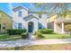 Two-story house with gray siding, landscaping, and walkway at 13419 Lake Monroe Pl, Riverview, FL 33579