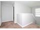 Upstairs hallway with neutral walls and carpet at 13419 Lake Monroe Pl, Riverview, FL 33579