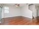 Living room features hardwood floors and access to a back patio at 13419 Lake Monroe Pl, Riverview, FL 33579