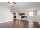 Open concept living room with hardwood floors and kitchen views at 13419 Lake Monroe Pl, Riverview, FL 33579