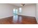 Spacious living room with hardwood floors and sliding glass doors at 13419 Lake Monroe Pl, Riverview, FL 33579