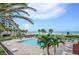 Inviting pool area with ocean views and ample lounge chairs at 1480 Gulf Blvd # 1106, Clearwater Beach, FL 33767