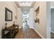 Long hallway with wood-look tile floors and built-in shelving at 1753 Montgomery Bell Rd, Wesley Chapel, FL 33543