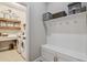 Laundry room with washer, dryer, and built-in storage at 1753 Montgomery Bell Rd, Wesley Chapel, FL 33543