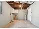 Unfinished basement with a water heater and built-in cabinets at 1829 West Dr, Clearwater, FL 33755