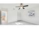 Spacious bedroom with ceiling fan and access to a full bathroom at 1829 West Dr, Clearwater, FL 33755