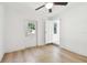 Bedroom with ceiling fan and access to patio at 1829 West Dr, Clearwater, FL 33755