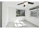 Bright bedroom with ceiling fan and backyard view at 1829 West Dr, Clearwater, FL 33755