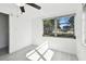 Sunny bedroom with ceiling fan and backyard view at 1829 West Dr, Clearwater, FL 33755