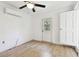 Bedroom with ceiling fan, A/C unit and exterior access at 1829 West Dr, Clearwater, FL 33755