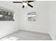 Well-lit bedroom with ceiling fan and vinyl plank flooring at 1829 West Dr, Clearwater, FL 33755