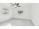 Bright bedroom with ceiling fan and light grey vinyl flooring at 1829 West Dr, Clearwater, FL 33755