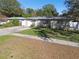 House exterior with a well-maintained lawn and driveway at 1829 West Dr, Clearwater, FL 33755