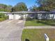House exterior with a well-maintained lawn and driveway at 1829 West Dr, Clearwater, FL 33755