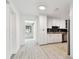 Modern kitchen with white cabinets, granite countertops and stainless steel appliances at 1829 West Dr, Clearwater, FL 33755