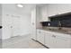 Newly renovated kitchen with granite countertops and white shaker cabinets at 1829 West Dr, Clearwater, FL 33755