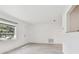 Spacious living room with hardwood floors and a view of the front yard at 1829 West Dr, Clearwater, FL 33755