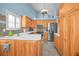 Modern kitchen with stainless steel appliances and wood cabinets at 1929 Northfork Cir, Clearwater, FL 33760