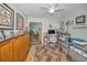 Bright home office with desk, chair, and view of living room at 1929 Northfork Cir, Clearwater, FL 33760