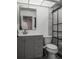 Updated bathroom with gray vanity, new fixtures and a glass shower at 3077 Branch, Clearwater, FL 33760