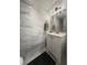 Clean bathroom with marble-style tile and a white vanity at 3077 Branch, Clearwater, FL 33760