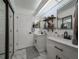 Updated bathroom with double vanity and marble-look flooring at 3077 Branch, Clearwater, FL 33760