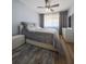 Spacious bedroom with light gray bedding and a ceiling fan at 3077 Branch, Clearwater, FL 33760