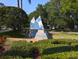 Community entrance with attractive landscaping and signage at 3077 Branch, Clearwater, FL 33760