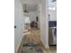 Open concept hallway with view of the living area and staircase at 3077 Branch, Clearwater, FL 33760