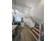 Bright living room with staircase, hardwood floors, and open concept at 3077 Branch, Clearwater, FL 33760