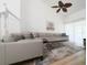 Spacious living room with large sectional sofa and hardwood floors at 3077 Branch, Clearwater, FL 33760