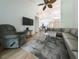 Bright living room with hardwood floors, sectional sofa, and high ceilings at 3077 Branch, Clearwater, FL 33760