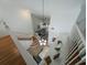 Open living room with high ceilings and hardwood floors, viewed from above at 3077 Branch, Clearwater, FL 33760