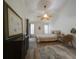 Main bedroom with a king-size bed, dresser and ceiling fan at 3077 Branch, Clearwater, FL 33760