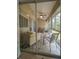 Cozy screened patio with seating area, perfect for relaxing at 3077 Branch, Clearwater, FL 33760