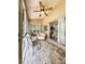 Relaxing screened porch with tiled floor and patio furniture at 3077 Branch, Clearwater, FL 33760