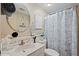 Bathroom with updated vanity and shower/tub combo at 35827 Verda Dr, Zephyrhills, FL 33541