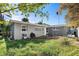 Side view of a ranch-style house with a gray exterior at 4019 Helena Ne St, St Petersburg, FL 33703