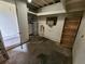 Unfinished basement with a water heater, exposed ceiling beams and a small book shelf at 4735 22Nd N Ave, St Petersburg, FL 33713