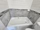 Bathroom featuring a bathtub with gray tile and a tiled backsplash at 4735 22Nd N Ave, St Petersburg, FL 33713