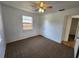 Bedroom with ceiling fan and patterned brown carpet at 4735 22Nd N Ave, St Petersburg, FL 33713