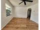 Bright living room with wood-look floors and ceiling fan at 4735 22Nd N Ave, St Petersburg, FL 33713