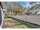 Landscaped backyard with tall privacy wall at 4950 Pond Ridge Dr, Riverview, FL 33578