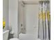Clean bathroom with shower/tub and gray shower curtain at 4950 Pond Ridge Dr, Riverview, FL 33578